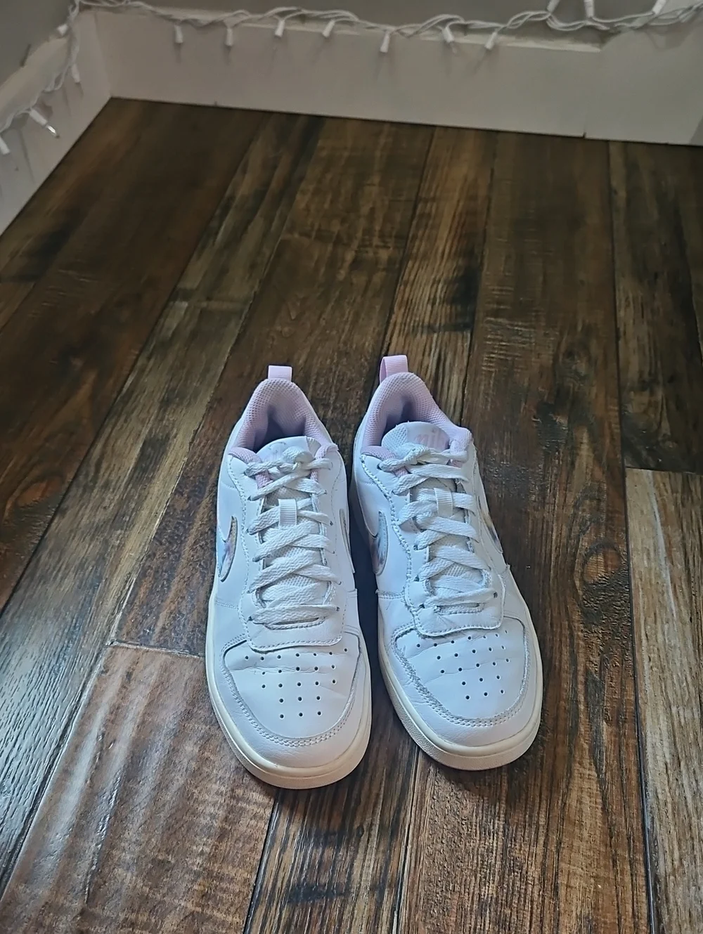 Nike White Low-Top Sneakers with Marbled Swoosh and Pink Details